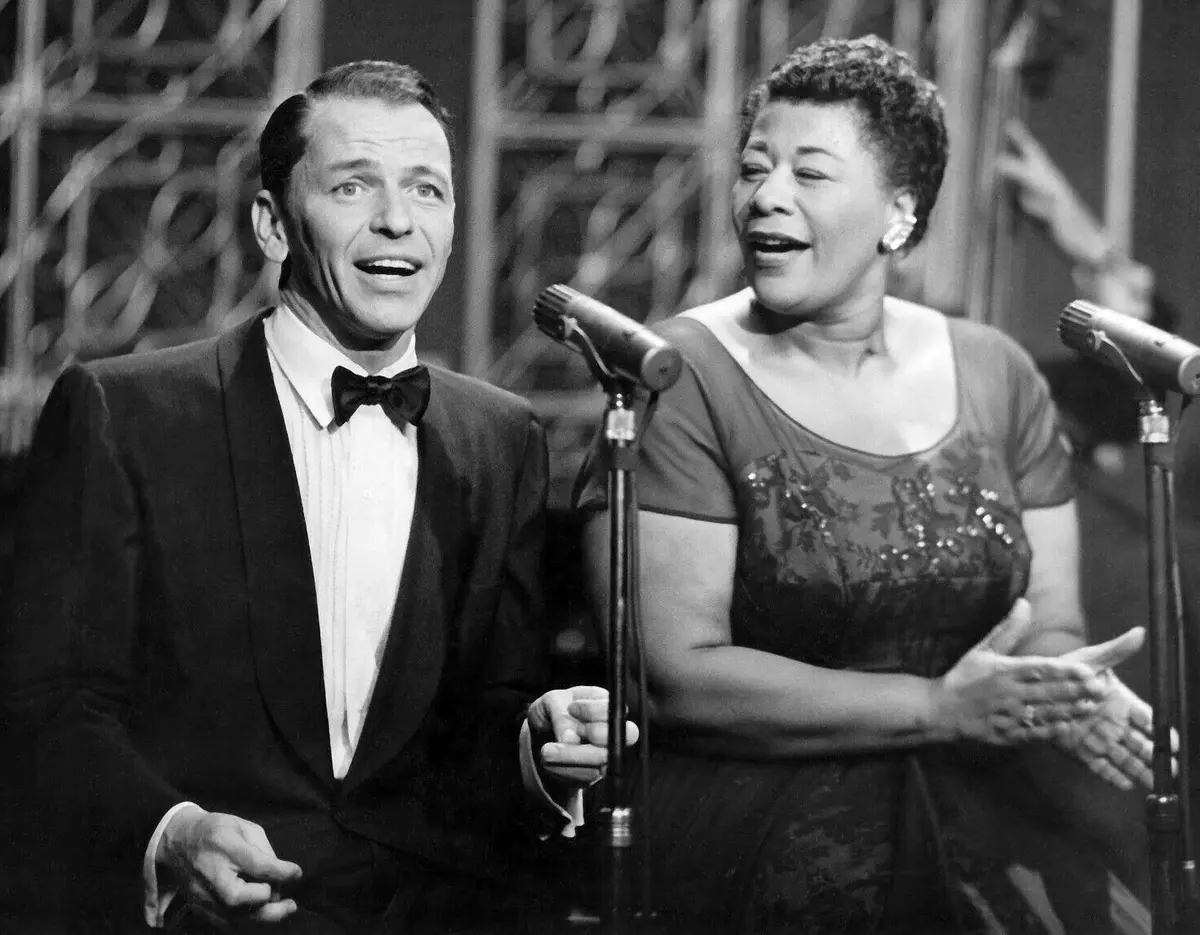 With Ella Fitzgerald on television, 1958. ABC publicity photograph